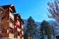 Homes with Swiss flag on the country side of Switzerland