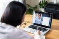 Homeschool Caucasian cute young girl student learning virtual internet online class from school teacher by remote meeting due to c Royalty Free Stock Photo