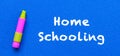 Homeschool. Words or typed text on blue board. With a yellow crayon