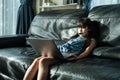Homeschool young Asian little girl student feel bore from doing homework, assigned job and virtual learn internet online class fro
