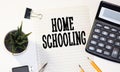Homeschooling. word Homeschooling on a blackboard