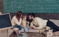 Homeschooling concept. Parents teaching kid, speaking. Boy listening to mom and dad with attention. Parents teaches son Royalty Free Stock Photo