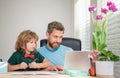 homeschooling and elearning. back to school. amazed father and son use computer at home. Royalty Free Stock Photo