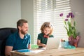 homeschooling and elearning. back to school. glad daddy and son in glasses use computer Royalty Free Stock Photo