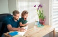 homeschooling and elearning. back to school. happy dad and son in glasses use laptop Royalty Free Stock Photo