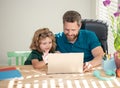 homeschooling and estudy. back to school. father and son use computer at home. Royalty Free Stock Photo