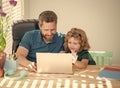 homeschooling and estudy. back to school. father and son use computer at home. Royalty Free Stock Photo