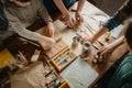 homeschooling family working together on project, with materials and supplies spread out on the table