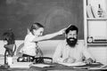 Homeschooling with father. Reward and punishment principle. Help study. Discipline and upbringing. Man bearded pedagogue
