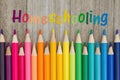 Homeschooling message with pencil crayons Royalty Free Stock Photo