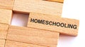 Homeschooling text written on wood block for your desing, Top view, Education concept Royalty Free Stock Photo