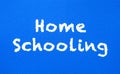 Homeschooling. Words or typed text on blue board