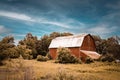 homestead farm prairie red barn overgrown abandoned empty vintage landscape plain Royalty Free Stock Photo