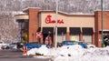 Homestead, Pennsylvania, USA 12-19-20 Cars in the drive thru lane at the Chik Fil A restaurant Royalty Free Stock Photo