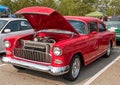 Homestead, Pennsylvania, USA July 21, 2021 A vintage red coupe automobile from the 1950s with it`s hood open Royalty Free Stock Photo