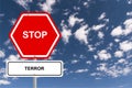 Stop terror traffic sign on blue sky