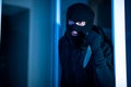 Criminal breaking in an apartment or office holding knife Royalty Free Stock Photo