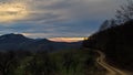 Homolje mountains landscape with a winding gravel country road at sunset of an autumn sunny day Royalty Free Stock Photo