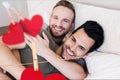 Homosexual couple embracing each other in bedroom at home Royalty Free Stock Photo