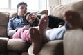 Young Gay Men Sleeping And Relaxing On Sofa At Home Royalty Free Stock Photo