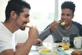 Gay Couple Eating Breakfast At Home In the Morning Royalty Free Stock Photo