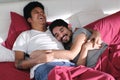 Homosexual Couple Hugging and Relaxing In Bed