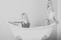 Homosexual love and LGBT, copy space. Spa and relaxation, pretty girls in white bath Royalty Free Stock Photo