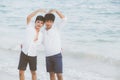 Homosexual portrait young asian couple stand gesture heart shape together on beach in summer Royalty Free Stock Photo