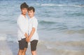 Homosexual portrait young asian couple standing together on beach in summer, asia gay holding hands going sea Royalty Free Stock Photo