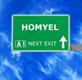 HOMYEL road sign against clear blue sky Royalty Free Stock Photo