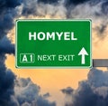 HOMYEL road sign against clear blue sky Royalty Free Stock Photo