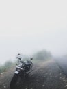 Honda cb350 Motorcycle in the mountains covered by fog and mist Royalty Free Stock Photo