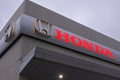 Honda dealership showroom sign and building