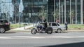 Honda VTX motorcycle in motion on the city street. Biker is riding cruiser with leather side bags, on the urban road