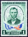 HONDURAS - CIRCA 1959: A stamp printed in Honduras shows Abraham Lincoln and flags, circa 1959.