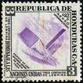 HONDURAS - CIRCA 1953: A stamp printed in Honduras issued to honor the United Nations shows U.N. building, New York, circa 1953.