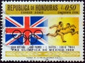 HONDURAS - CIRCA 1968: A stamp printed in Honduras shows Tokyo gold medalists Ann Packer and Lynn Davies with British flag