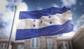 Honduras Flag 3D Rendering on Blue Sky Building Background