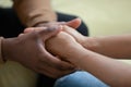 During honest conversation husband holds hands of wife closeup view Royalty Free Stock Photo