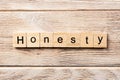 Honesty word written on wood block. honesty text on table, concept