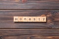 Honesty word written on wood block. honesty text on table, concept