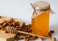 Honey with almonds and hohey spoon