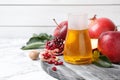 Honey, apples and pomegranate on white table. Rosh Hashanah holiday Royalty Free Stock Photo