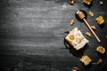 Honey background. Natural honey comb and a wooden spoon . Royalty Free Stock Photo