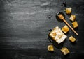 Honey background. Natural honey comb and a wooden spoon . Royalty Free Stock Photo