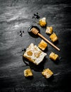 Honey background. Natural honey comb and a wooden spoon . Royalty Free Stock Photo