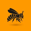 Honey bee silhouette on orange background