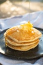 Honey being pour onto stack of pancake Royalty Free Stock Photo