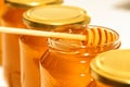 Honey in bottles. Honey dipper Royalty Free Stock Photo