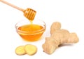 Honey in bowl and a slices ginger root Royalty Free Stock Photo